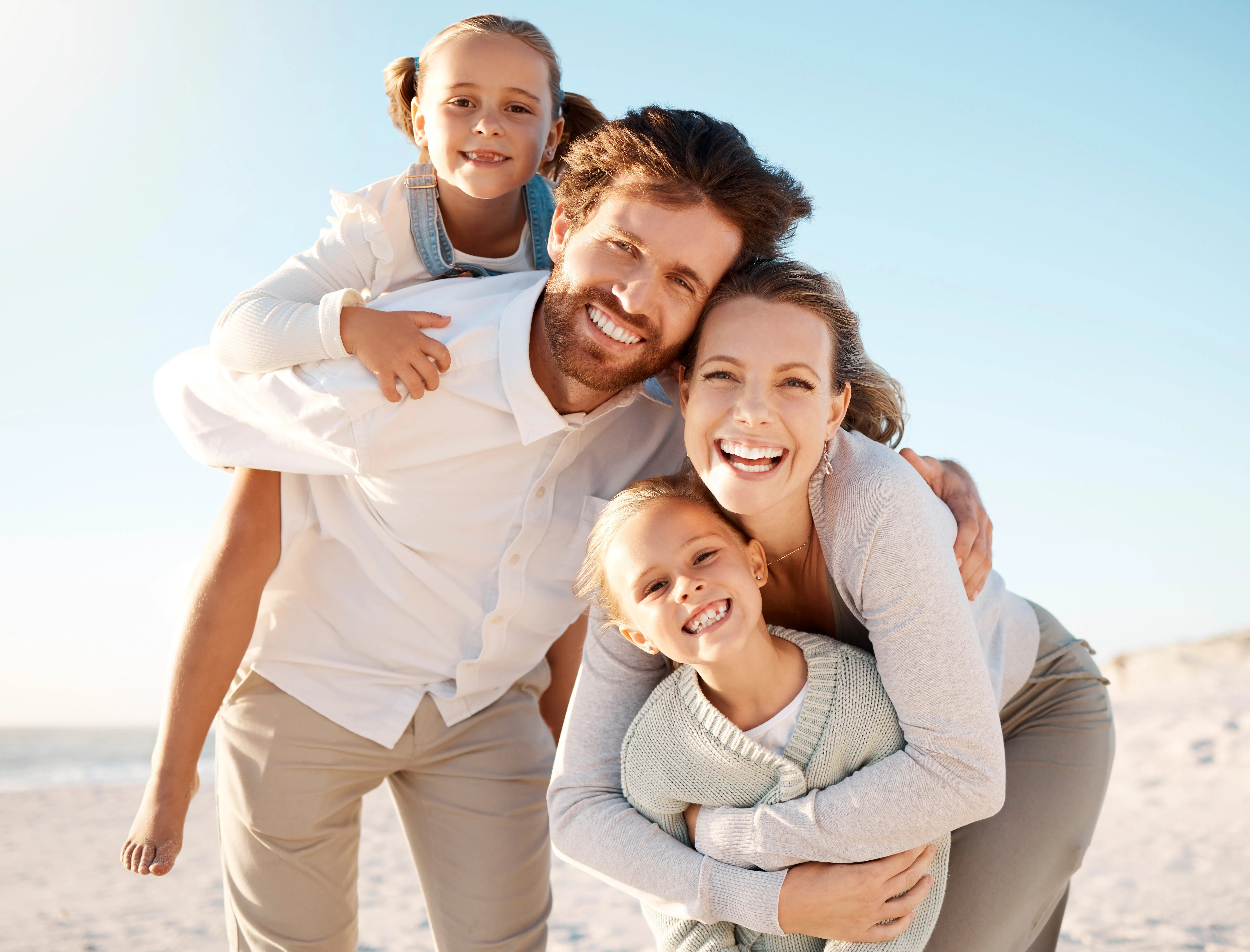 A smiling family together outdoors