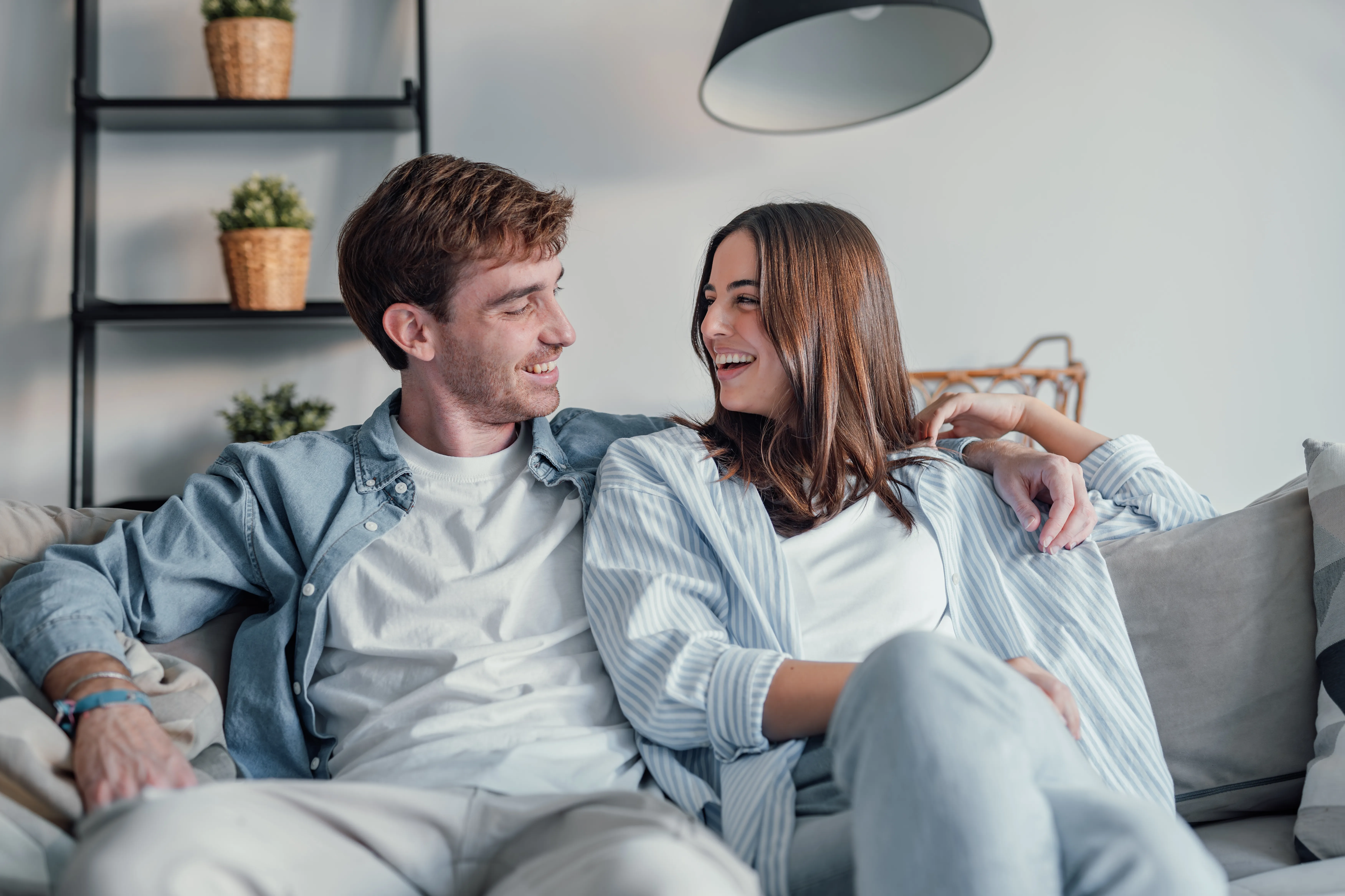 A couple relaxing together at home